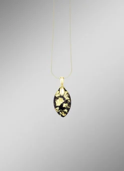 Anhänger mit Onyx, beh. und Bergkristall mit Blattgold-Triplette