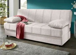 Frei im Raum aufstellbares Schlafsofa mit Dekokissen und Bettkasten