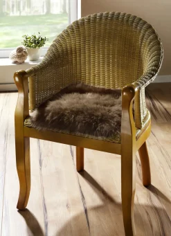 Merino-Lammfell-Sitzauflage in Tierform