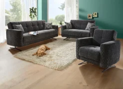 Polstermöbel mit Bettfunktion und Dekokissen